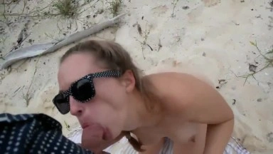 Couple being naughty on a vacation beach